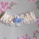 Ivory bridal garter with bl..