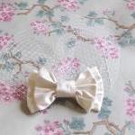 Ivory silk bow birdcage vei..
