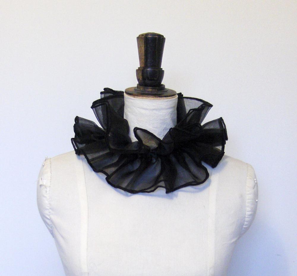 Black organza cirque neck ruffle.