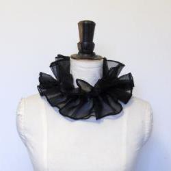 Black organza cirque neck ruffle.