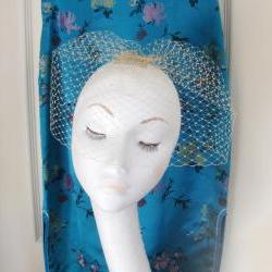 Champagne birdcage veil.