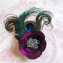 Magenta silk peacock feather corsage.